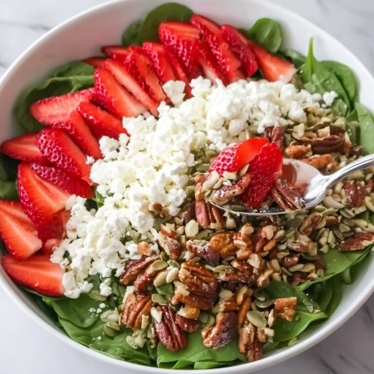 Strawberry Arugula Salad with Candied Almonds, Pistachios, and Champagne Vinaigrette Recipe